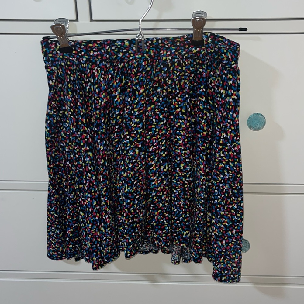 A colorful confetti skirt, size large in kids I think.